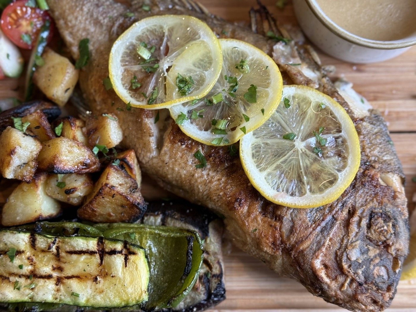 Whole roasted fish dusted with herbs and lemon