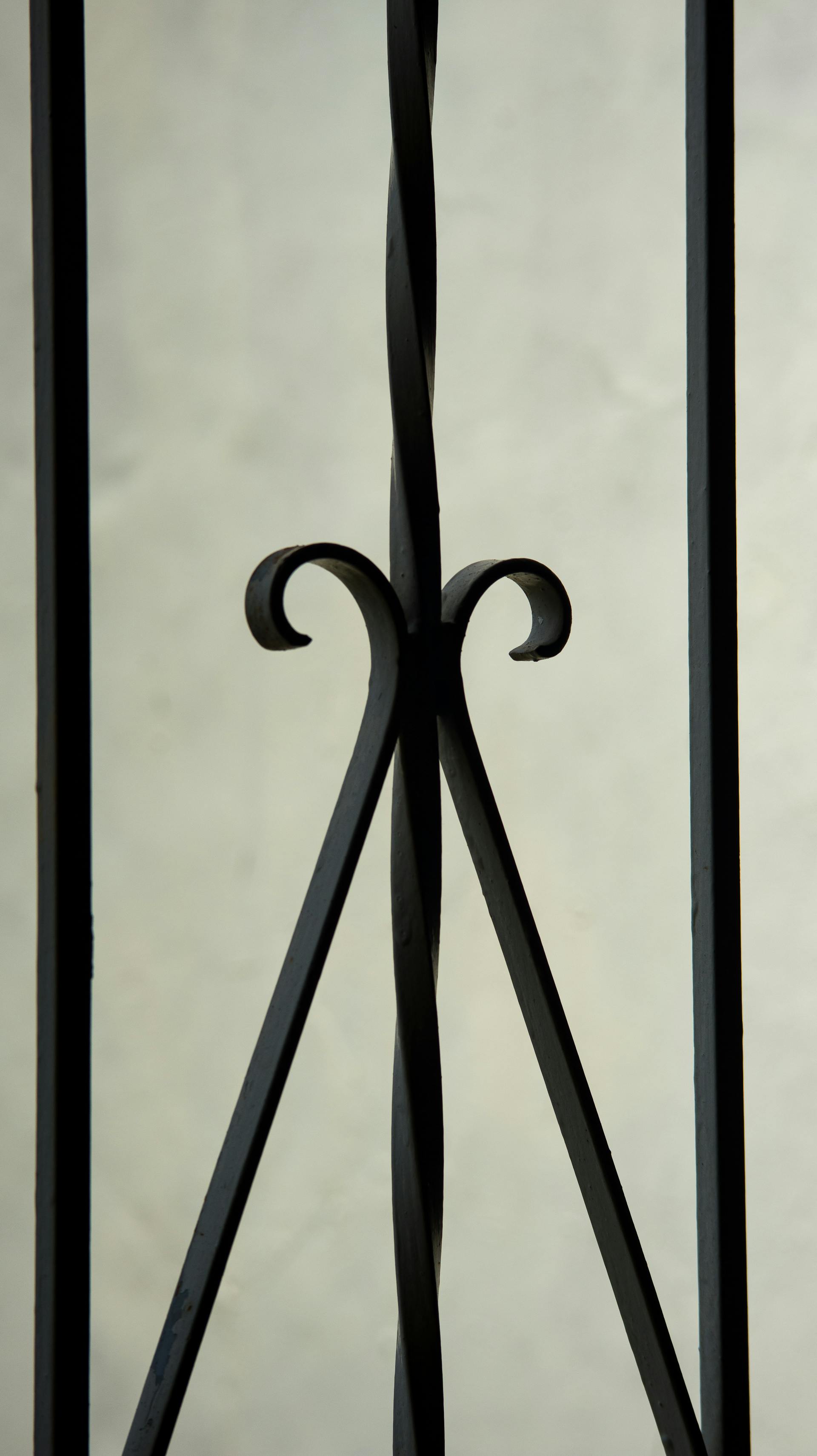 Close-up detail of ornate wrought iron railing forged by Naz Khorram